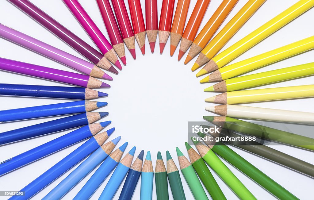 Isolated Circle with Colorful Crayons Close-up photograph of colorful crayons in a circle over white. Art Stock Photo