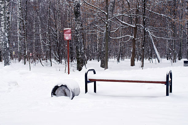 istock Bench and trashcan in snow 504821618