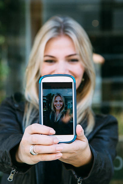 istock Pretty Young Blonde Taking a Selfie 504822451