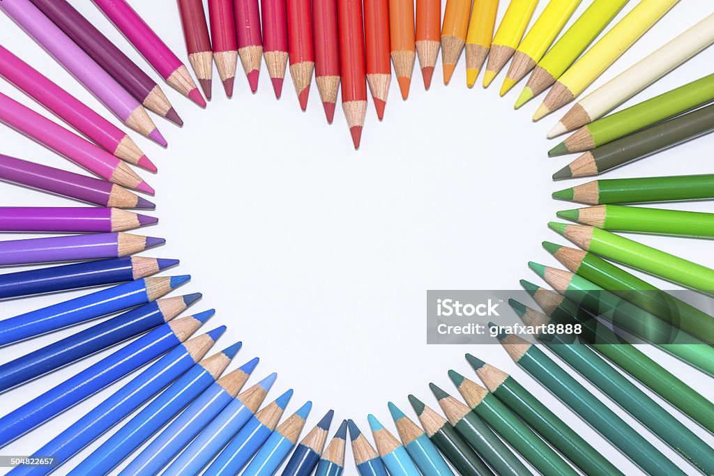 Heart made of Colorful Crayons Isolated colorful crayons formed in the shape of a heart. Artist's Palette Stock Photo