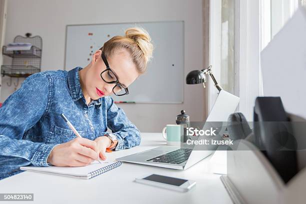 Blonde Woman Working In A Home Office Stock Photo - Download Image Now - Desk, Adult, Adults Only