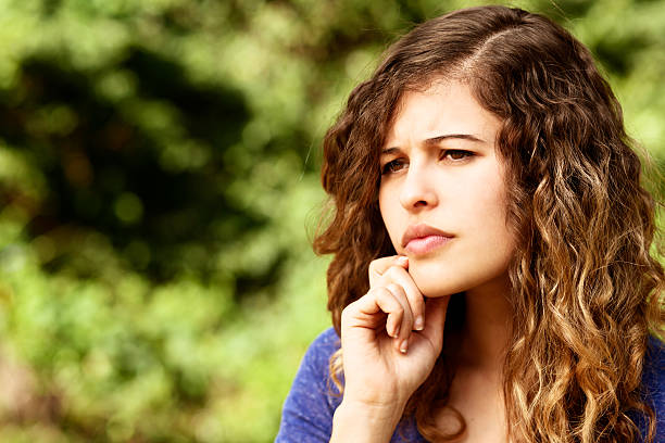istock Pensive young woman thinks things over 504823405
