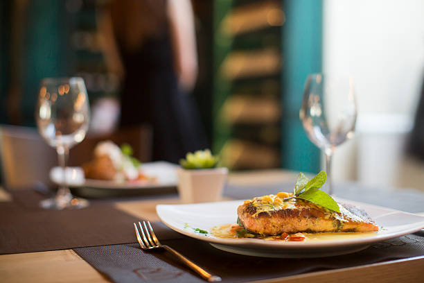 istock Grilled salmon with sauce and herbs 504824508