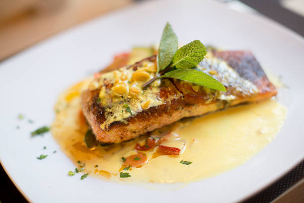 istock Grilled salmon with sauce and herbs 504825880