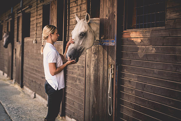 istock Woman with horse 504825926