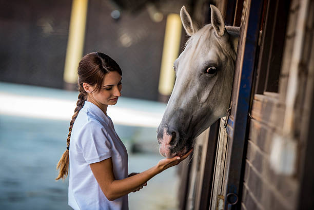 istock Woman with horse 504825990