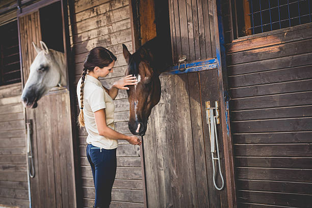 istock Woman with horse 504826212