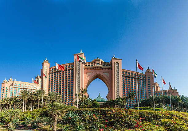 Atlantis, The Palm - Hotel in Dubai Dubai, United Arab Emirates - December 30, 2015: Atlantis Hotel, Palm Jumeirah. The beautiful and extravagant hotel, containing an aquarium inside the hotel, seen here on a sunny Dubai Winter day. atlantis the palm stock pictures, royalty-free photos & images