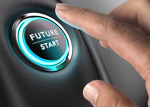 The Future is Now, Strategic Vision Finger about to press future button with blue light over black and grey background. Concept image for illustration of change or strategic vision. cycle vehicle stock pictures, royalty-free photos & images