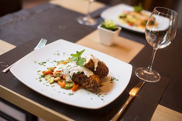 istock Grilled meat with sauce and herbs served at restaurant 504827514
