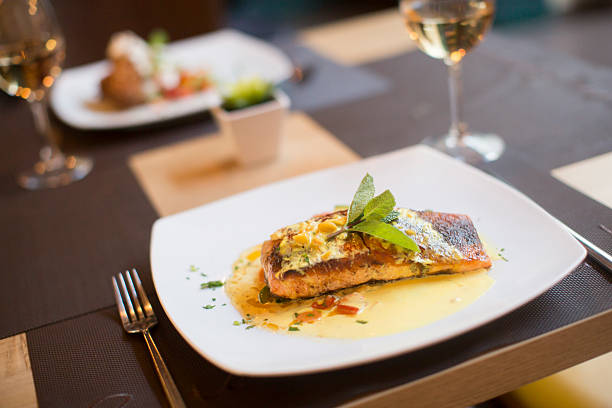 istock Grilled salmon with sauce and herbs 504827892