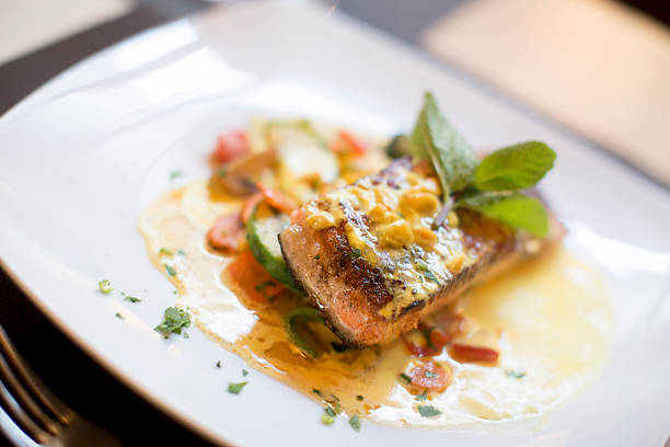 istock Grilled salmon with sauce and herbs 504828028