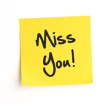 Miss You note on yellow sticky label