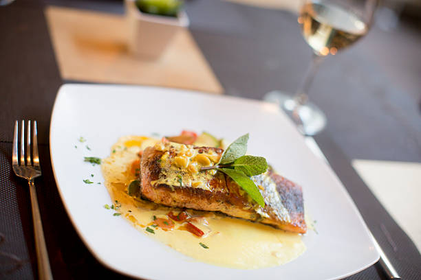 istock Grilled salmon with sauce and herbs 504828246