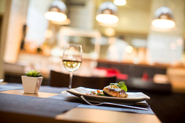 istock Grilled salmon with sauce and herbs served at restaurant 504828390