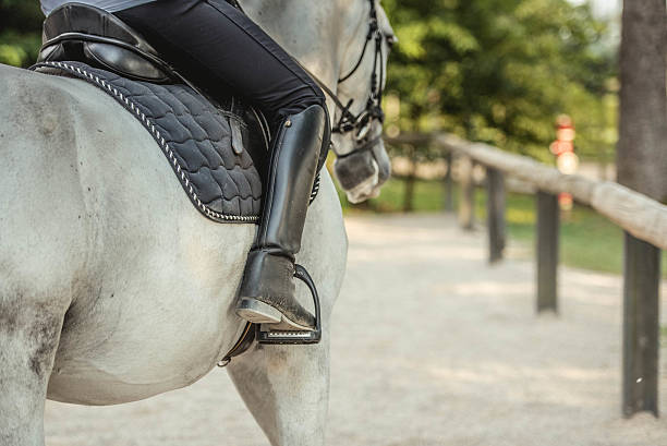 istock Woman riding horse 504828882