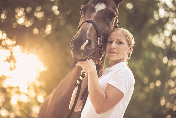 istock Woman with horse 504829130