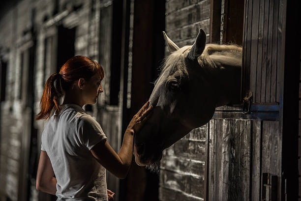 istock Woman with horse 504829340