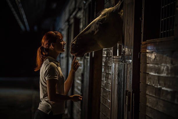 istock Woman with horse 504829378