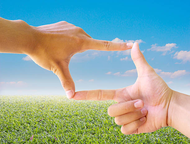 istock Photo sight:Frame made of hands with nature abstract background 504831588