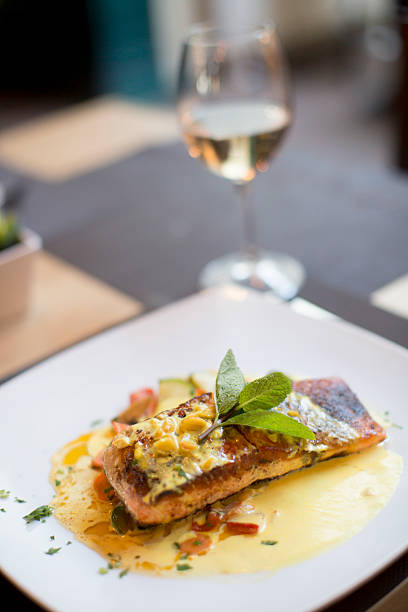 istock Grilled salmon with sauce and herbs 504852240