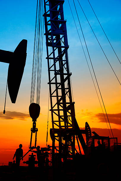 istock oil field, the oil workers are working 504852638