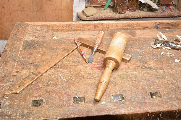 istock carpenter working with plane on wooden 504853078
