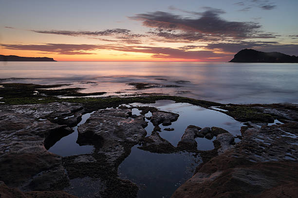 istock Dawn skies from Green Point Pearl Beach 504853160