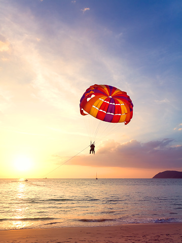 Paragliders at sunset, summer adventure concept, Langkawi Island in Malaysia.