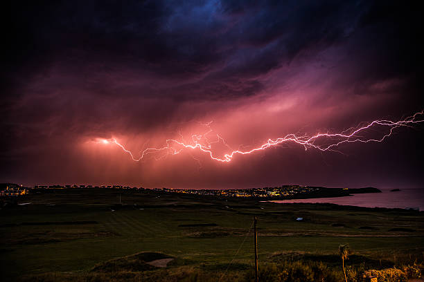 istock Light streaks across the sky over Newquay, Cornwall 504853407