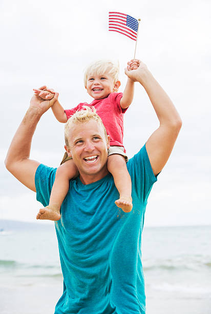 istock Father and son playing on the beach 504854113