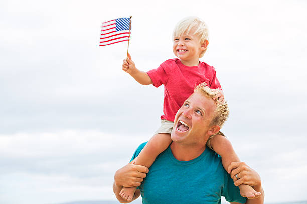 istock Father and son playing on the beach 504854115