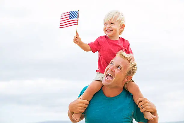 Photo of Father and son playing on the beach