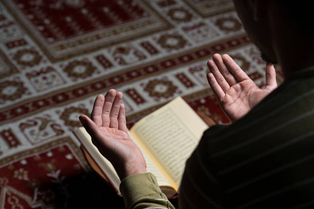 Muslim Man Is Reading The Koran stock photo