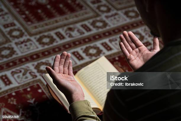 Muslim Man Is Reading The Koran Stock Photo - Download Image Now - Praying, Islam, Mosque