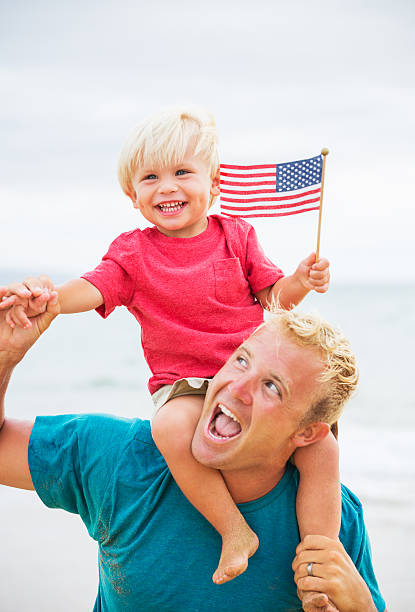 istock Father and son playing on the beach 504855057