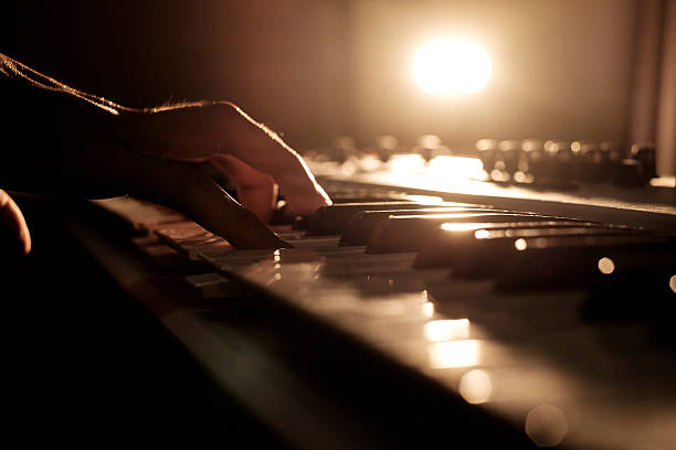 Playing keyboard A man's playing his keyboard. keyborad stock pictures, royalty-free photos & images