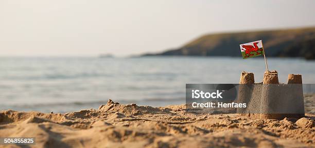 Beach Sea Sandcastle And Welsh Flag Stock Photo - Download Image Now - Building - Activity, Sandcastle - Structure, Child