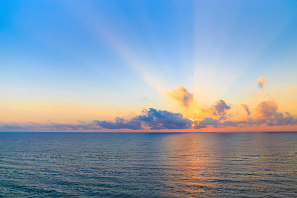 istock Sunrise casting beams of light into the air 504855892