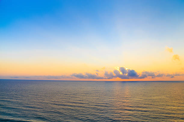istock Sunrise casting beams of light into the air 504855940