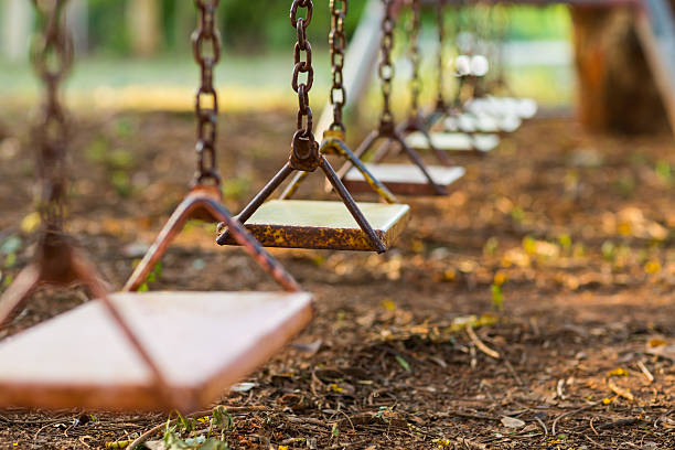 пустой swing - swing playground empty abandoned стоковые фото и изображения