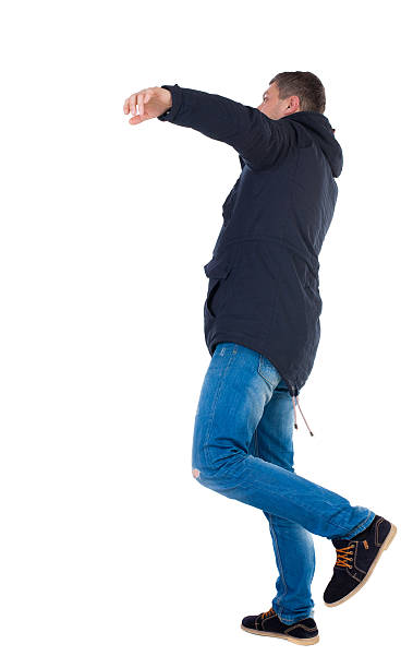 istock Balancing young man in parka. 504856058