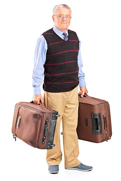 istock Senior gentleman carrying two bags 504856819