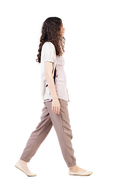 istock back view of walking  woman. 504856926