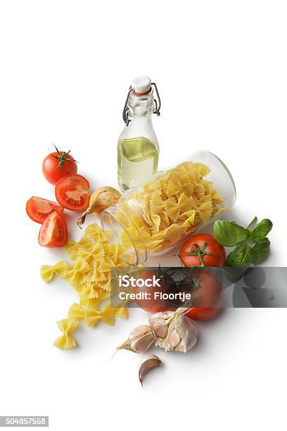 Italian Ingredients Farfalle Tomato Basil Onion Garlic And Oil Stock Photo - Download Image Now