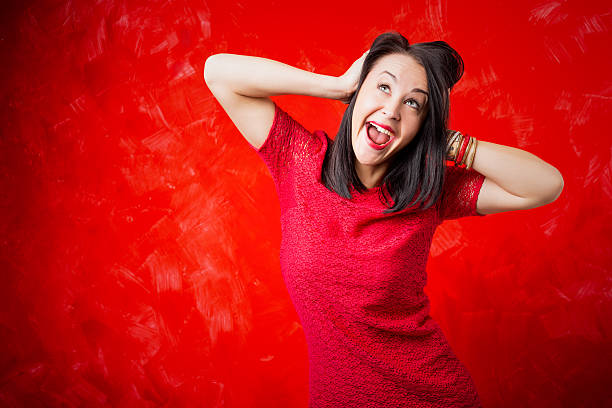 istock Woman holding her head in surprise 504857762