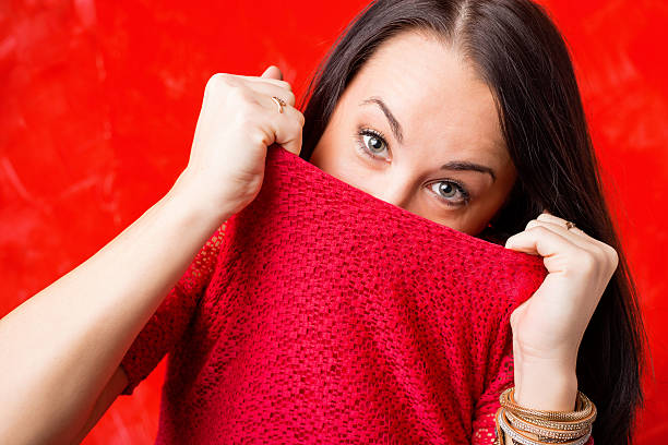 istock Woman trying to hide her face 504858022