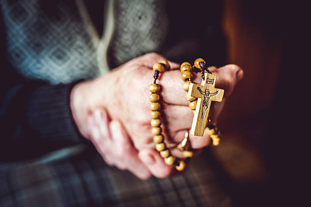 istock Hands of a Senior Woman Praying 504858366