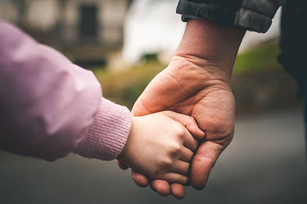Father and Daughter Holding Hands Father and child holding hands kids holding hands stock pictures, royalty-free photos & images