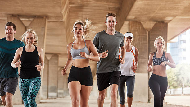 istock Adults exercising with running club group 504862724